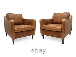A pair of Vintage Club Armchairs In Genuine Vintage Tan Leather The Dane