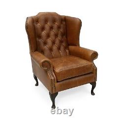 Chesterfield High Back Wing Chair & Footstool Presented In Vintage Tan Leather