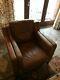 Pair of identical vintage tan leather armchairs in excellent condition