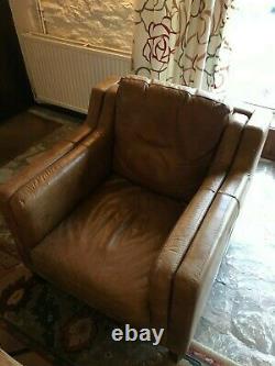 Pair of identical vintage tan leather armchairs in excellent condition