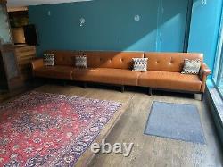 Vintage Tan Leather 7 Seat Couch on a Black Painted Wooden Frame 4450mm long